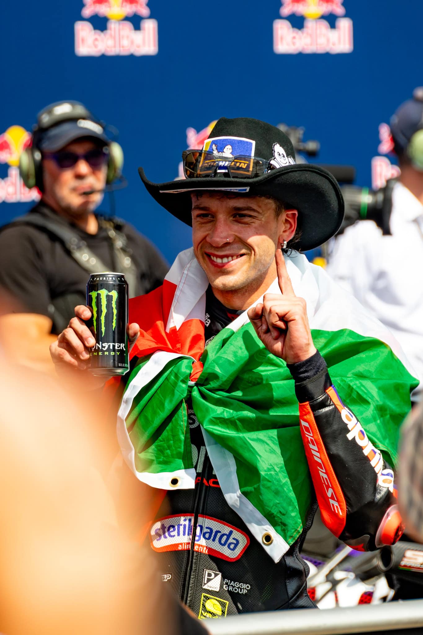 Marco Bezzecchi after the U.S.Grand Prix with an Italian flag around his shoulders.