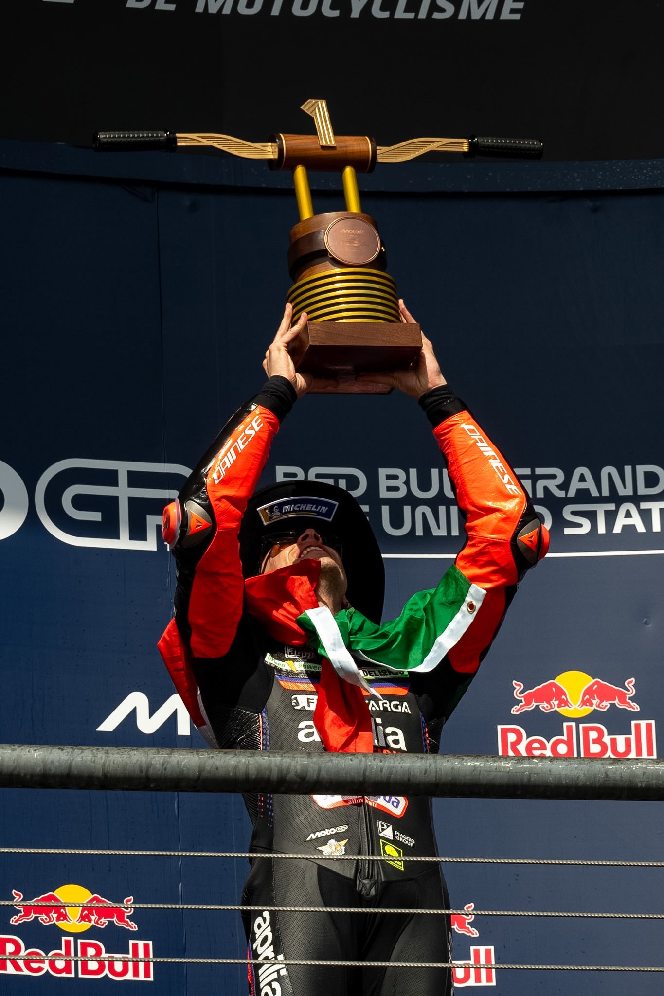 Marco Bezzecchi lifting up the P1 trophy at U.S.Grand Prix.